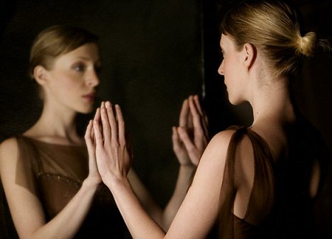 Woman Looking at Reflection